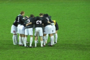 Warsaw soccer team huddle